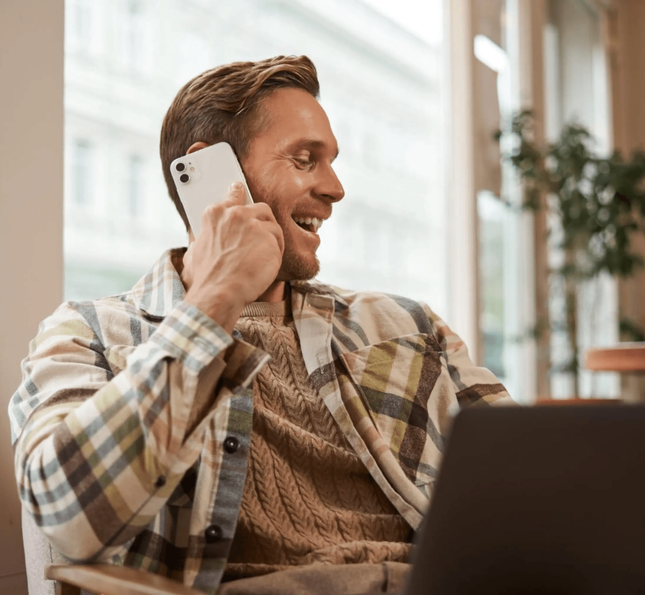 LeadPerk outbound sales caller speaking with a B2B decision-maker while working from a laptop.