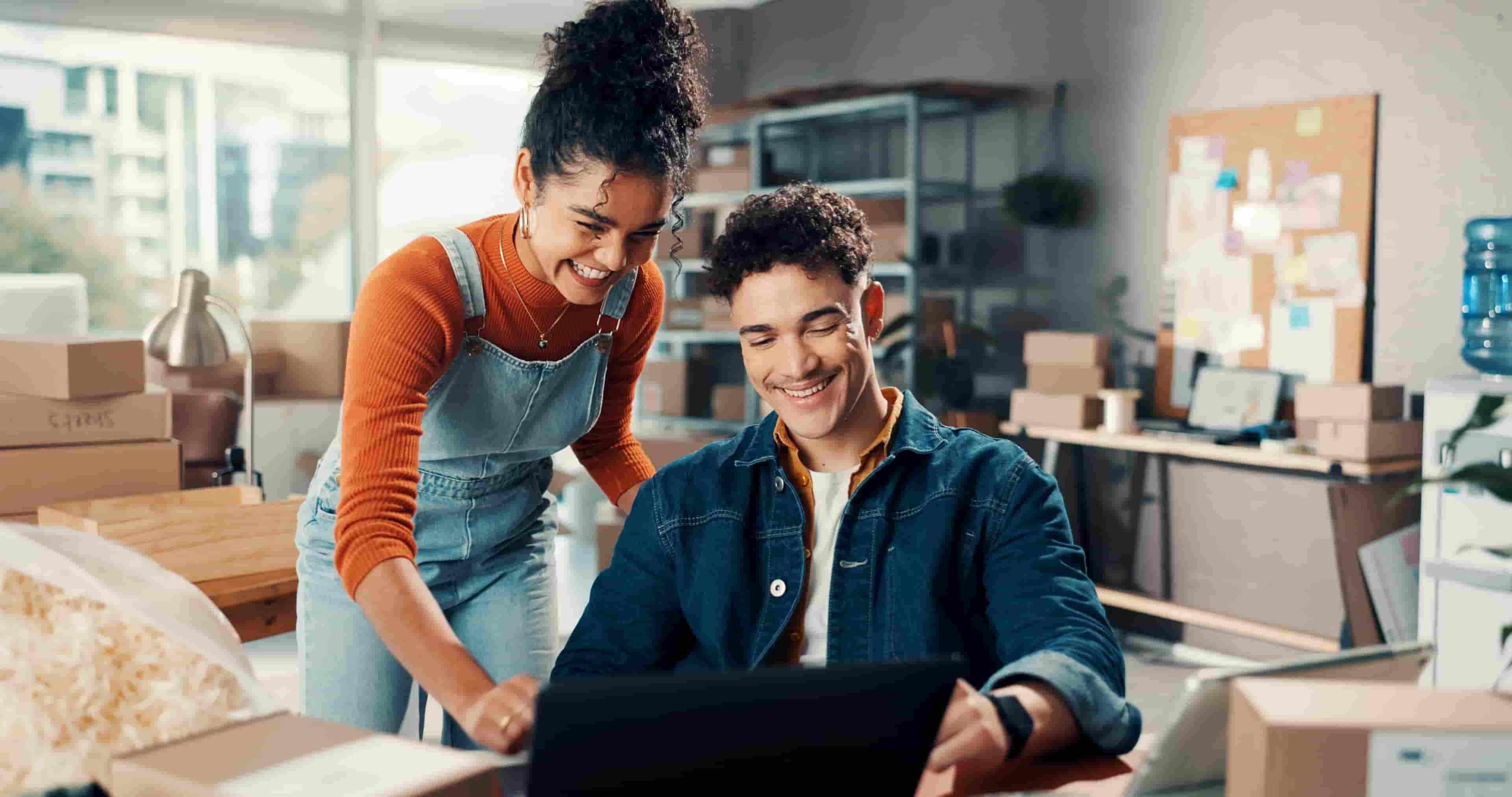LeadPerk sales professional reviewing B2B lead generation strategy on a laptop in a modern office