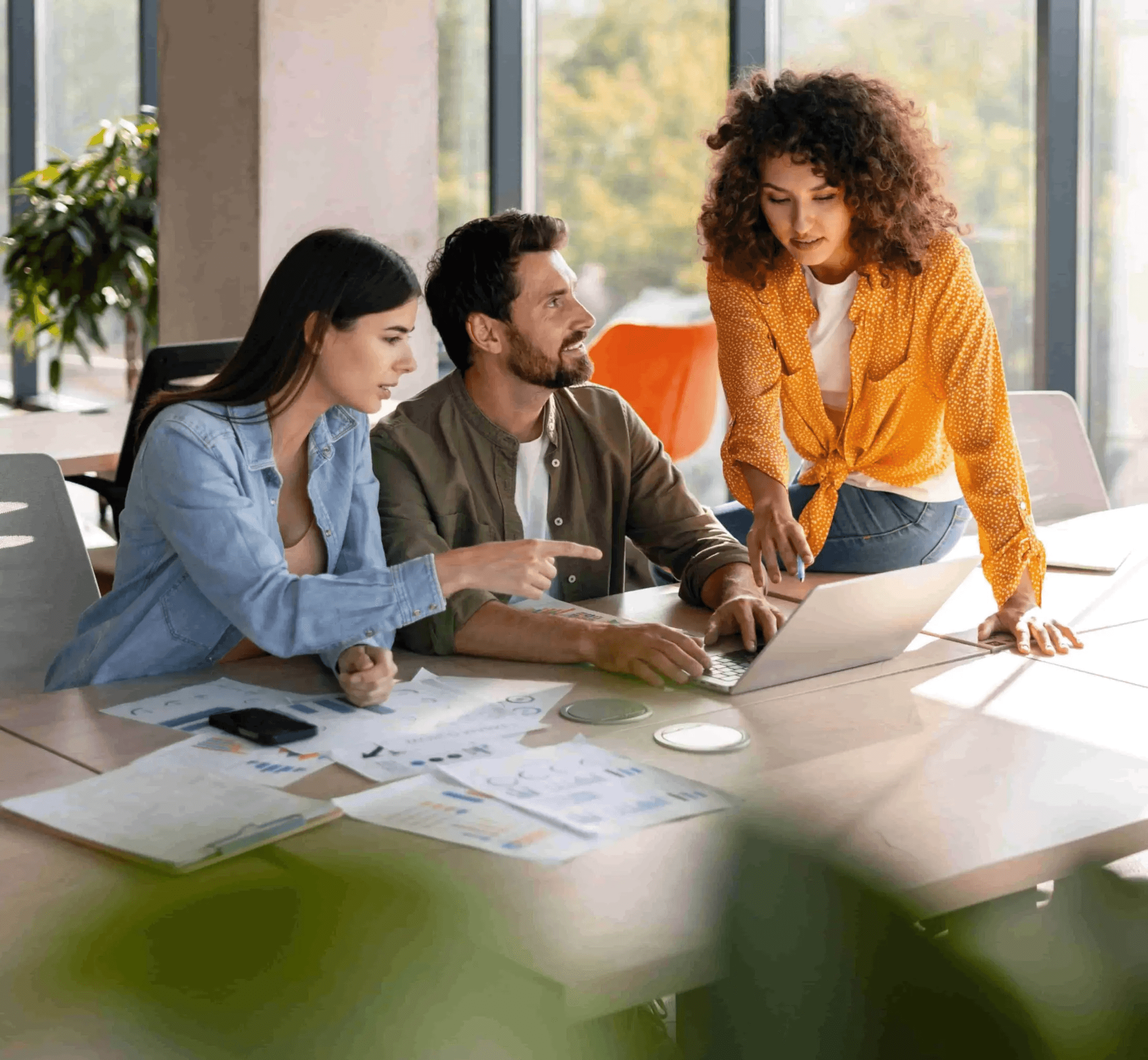 LeadPerk team collaborating in a modern Dublin office, working together on laptops and discussing outbound B2B lead generation campaigns.
